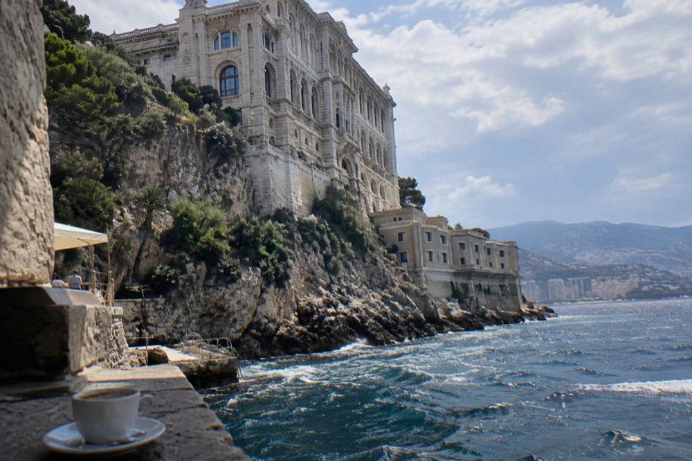 Oceanfront museum building on a cliff edge with terraced facade above the sea