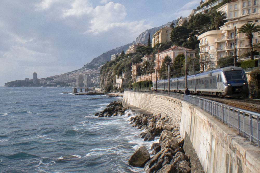 The entrance platform of Monaco Monte Carlo train station with a train at rest