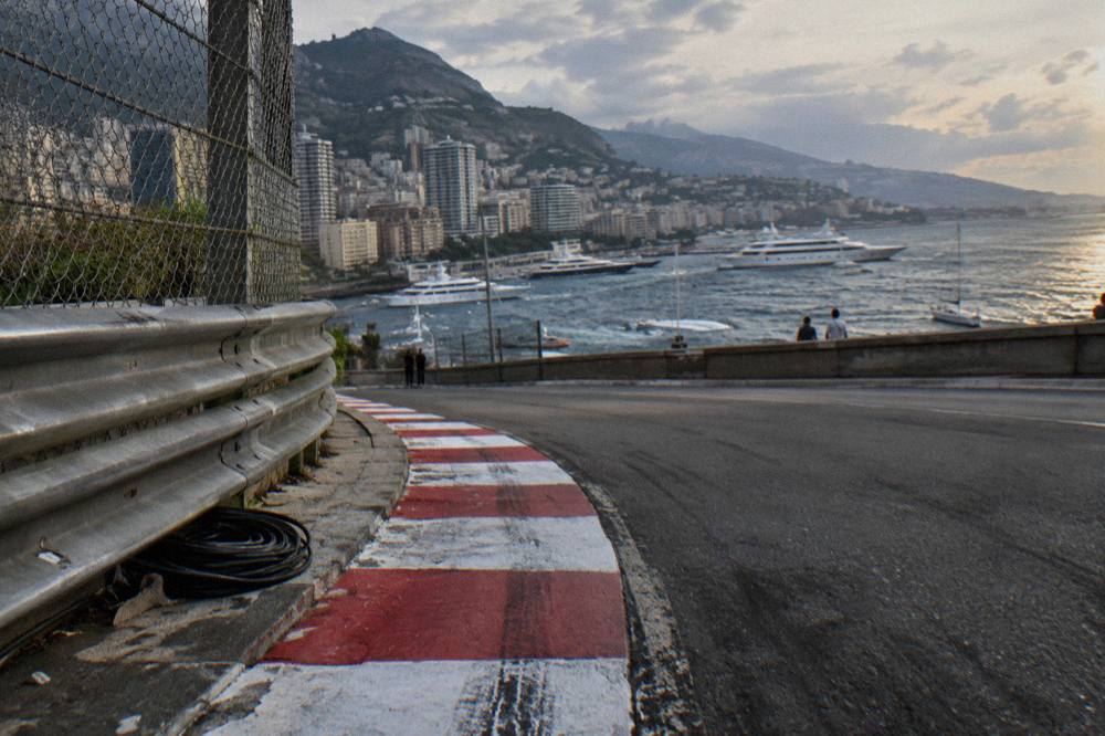 Formula 1 barriers and grandstands lining Monaco streets near the harbour