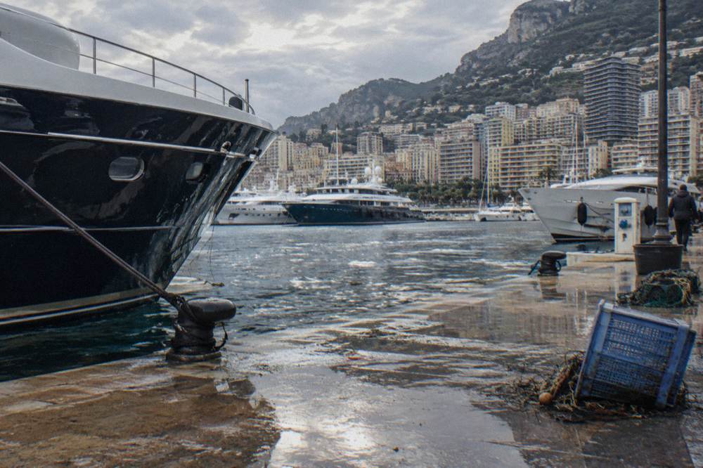 Harbour front at Monaco with superyachts and hillsides above the port