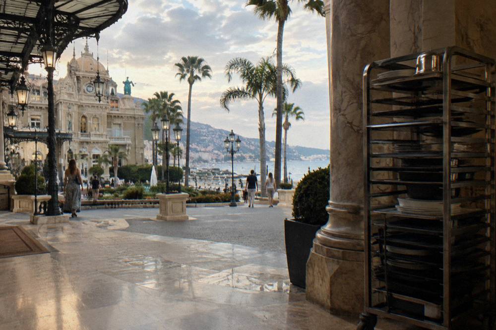 Casino square in Monte-Carlo with ornate building facades and palm trees