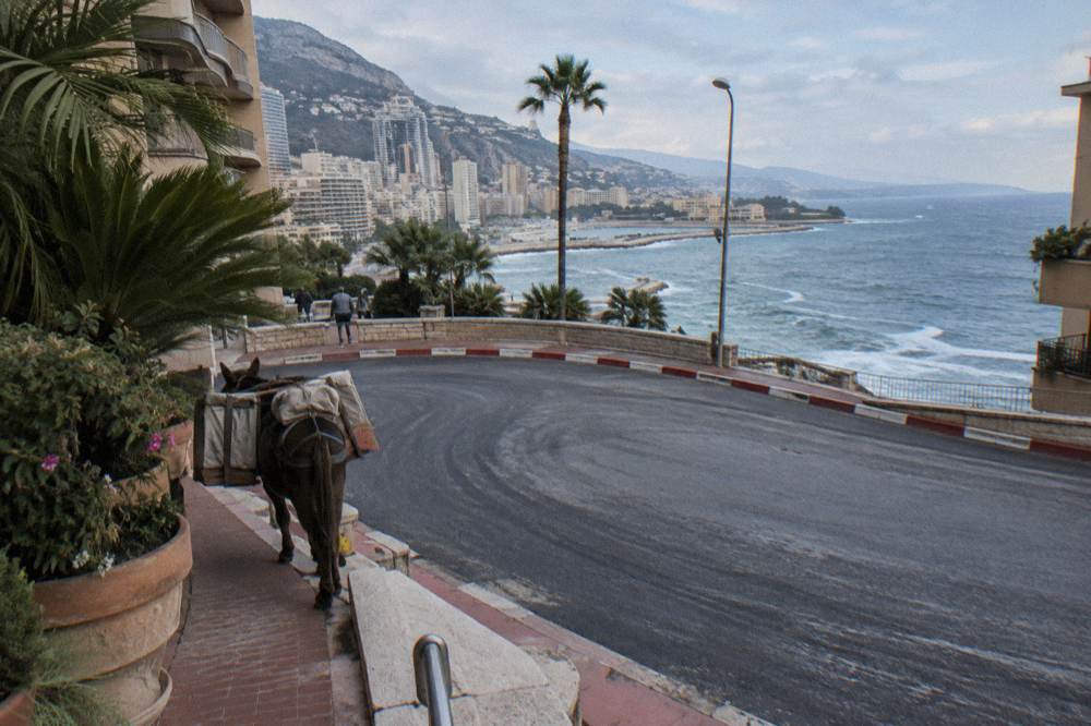 Coastal road curving along cliffs above the blue Mediterranean Sea