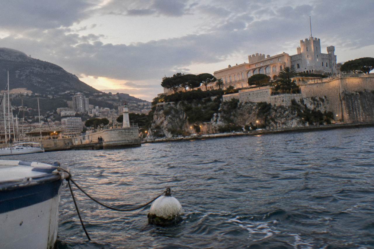 The Rock of Monaco rising above the Mediterranean with the old town buildings and the harbor below