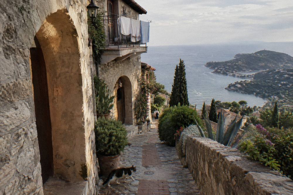 Narrow stone lane in a medieval hilltop village with arched doorways
