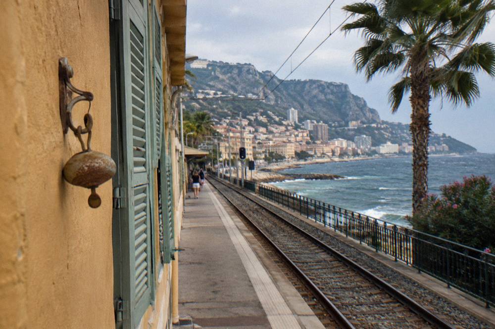 Narrow pastel lane in Menton old town with shuttered windows