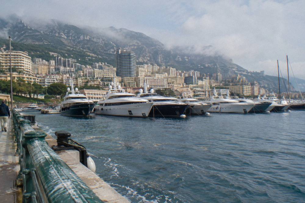 Monaco harbor with luxury yachts moored along the quays