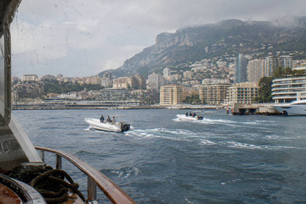 Tender boats crossing the bay toward the quays of Port Hercule at Monaco
