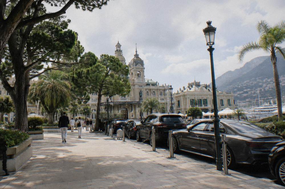 Casino square in Monte Carlo with ornate building facade and parked cars
