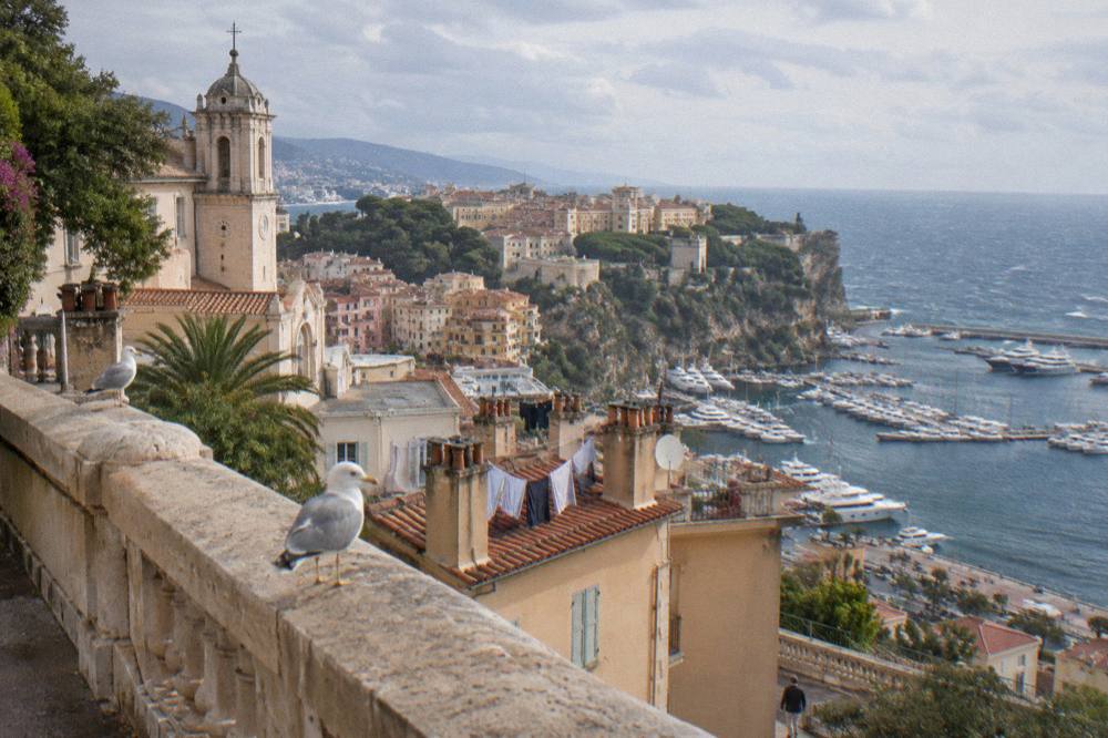 View over Monaco rooftops and harbor from the elevated old town ramparts
