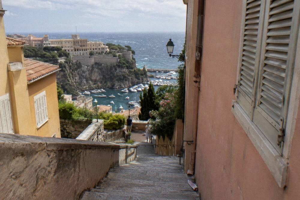 Narrow stone stairs and pastel buildings on the Monaco old town hillside