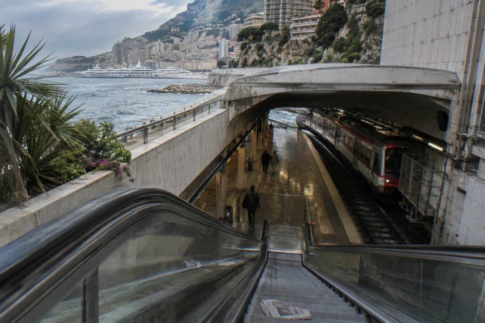 Monaco-Monte-Carlo railway station platform with harbor below