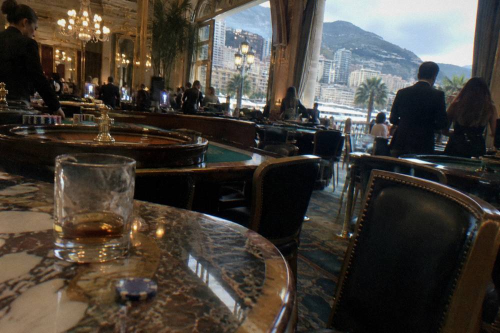 Casino gaming room interior with chandeliers and gaming tables