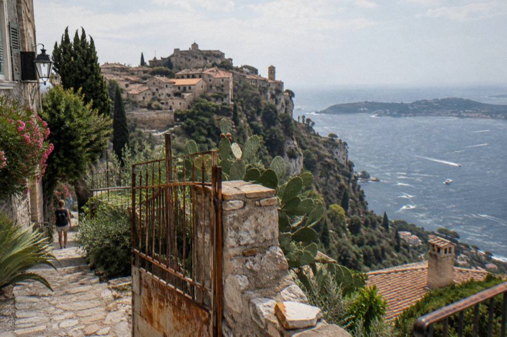 Medieval hilltop village with stone buildings overlooking the Mediterranean coastline