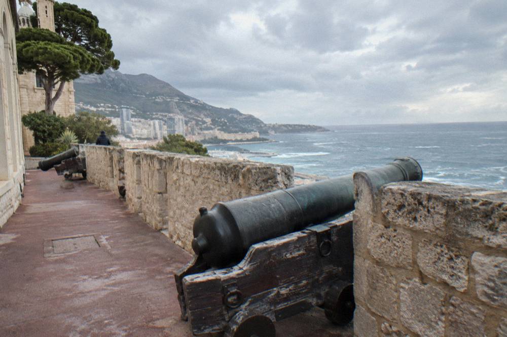 Stone ramparts of Monaco old town overlooking the sea and distant coastline