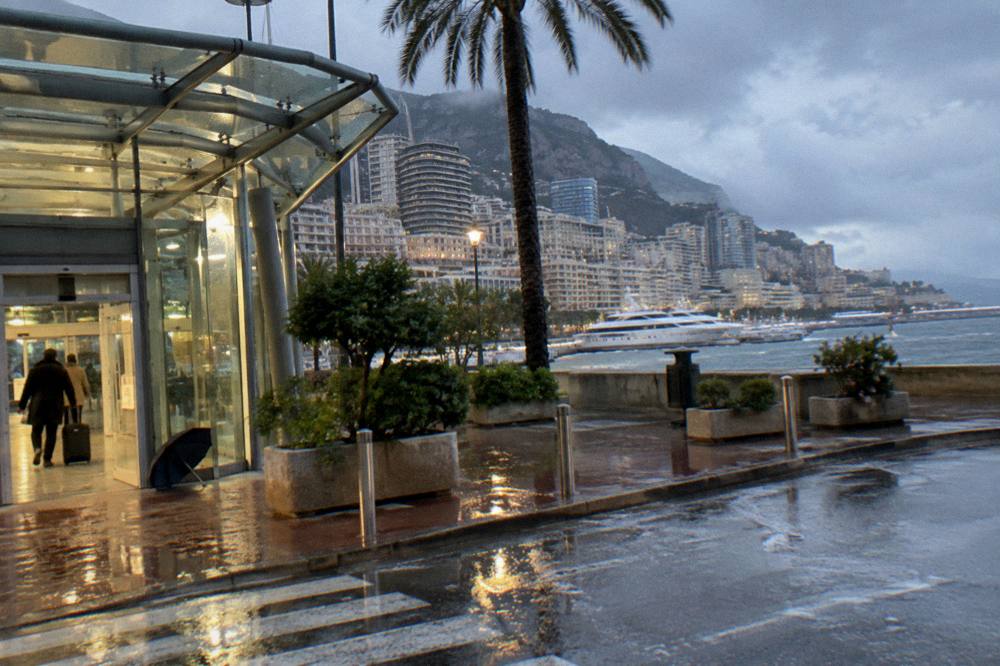 Monaco train station entrance below modern apartment towers