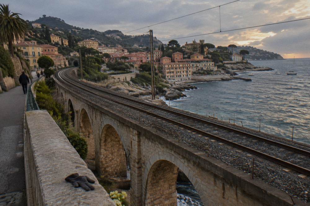 Railway tracks along the Mediterranean coast between Nice and Monaco at dusk