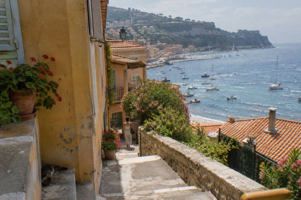 Hillside houses with terracotta roofs above the waterfront of Villefranche-sur-Mer