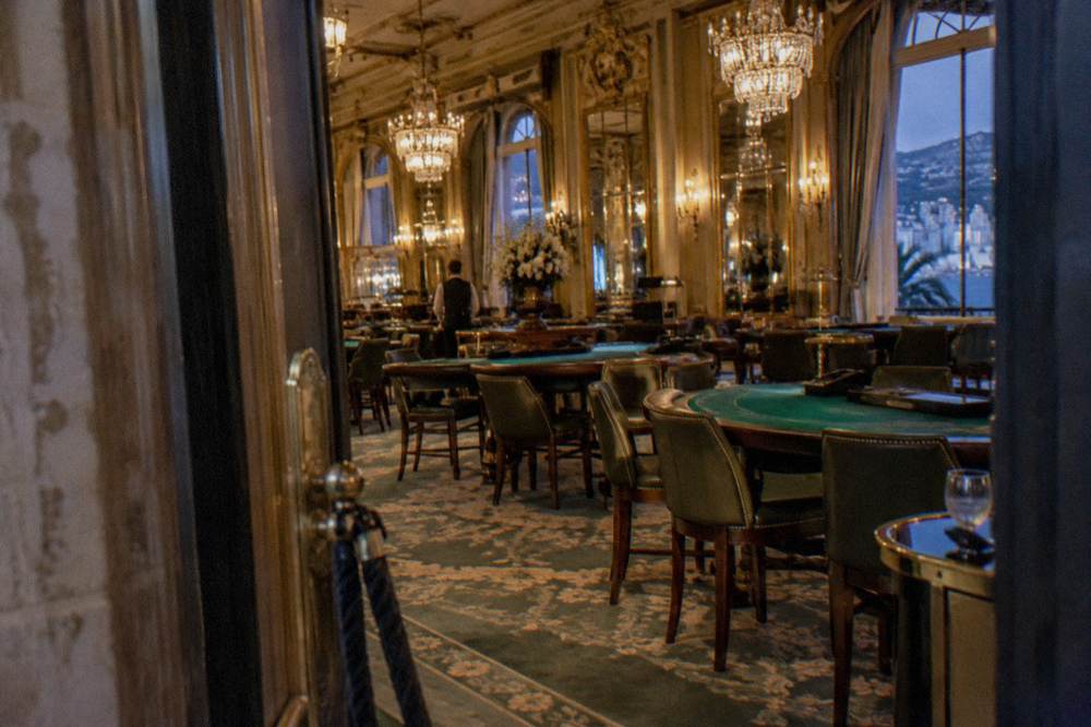 Elegant evening interior of a Monte-Carlo gaming hall with chandeliers
